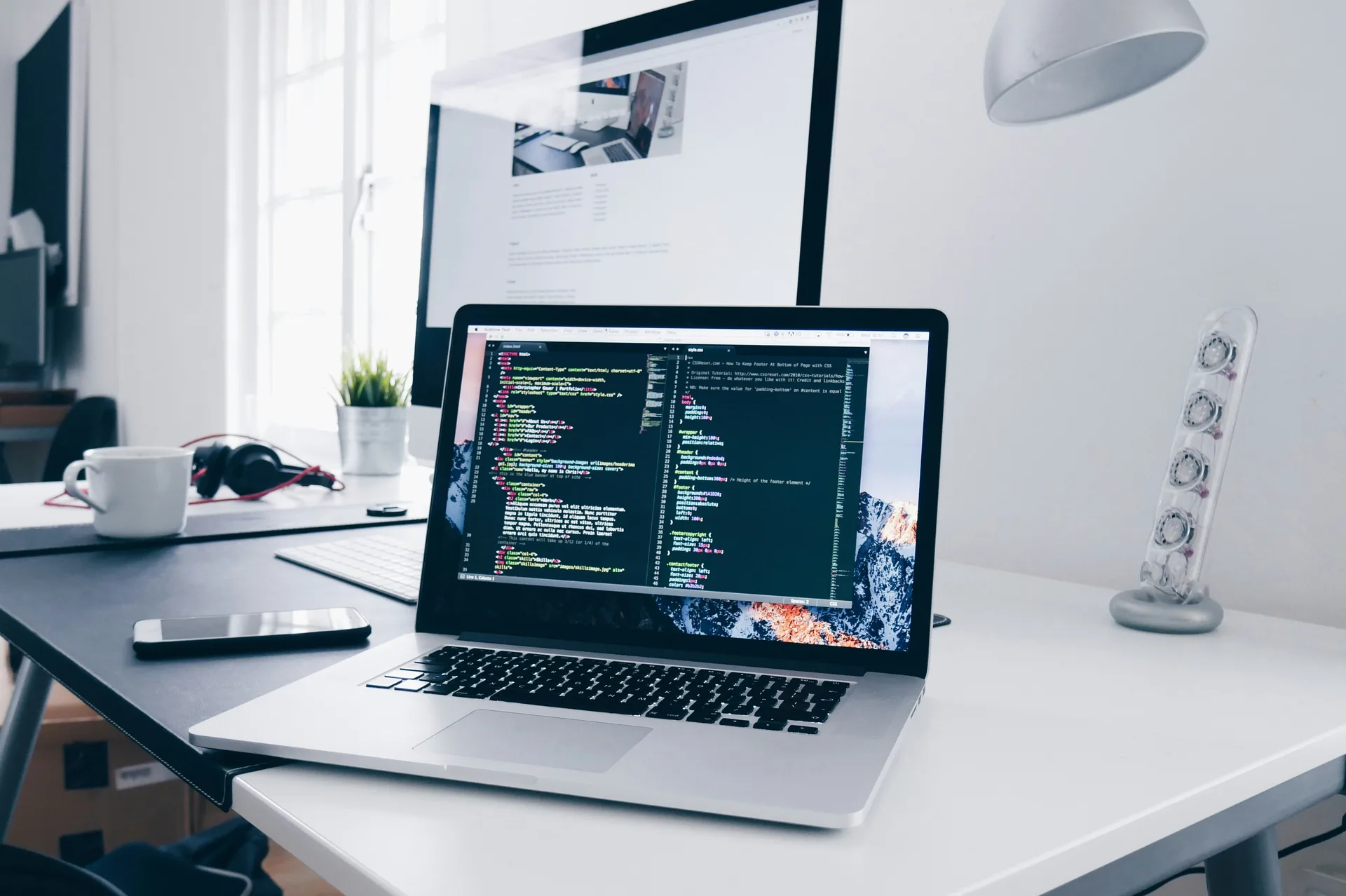 Laptop displaying brightly lit code editor