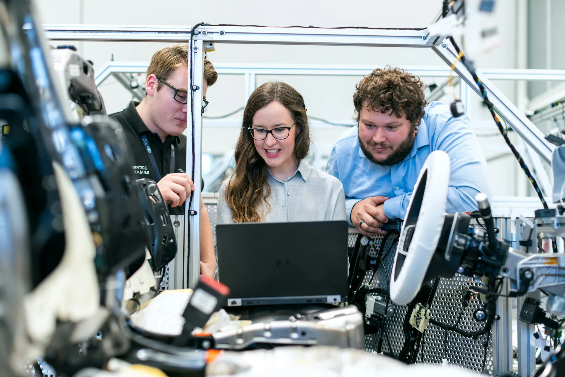 Engineering team working together at computers